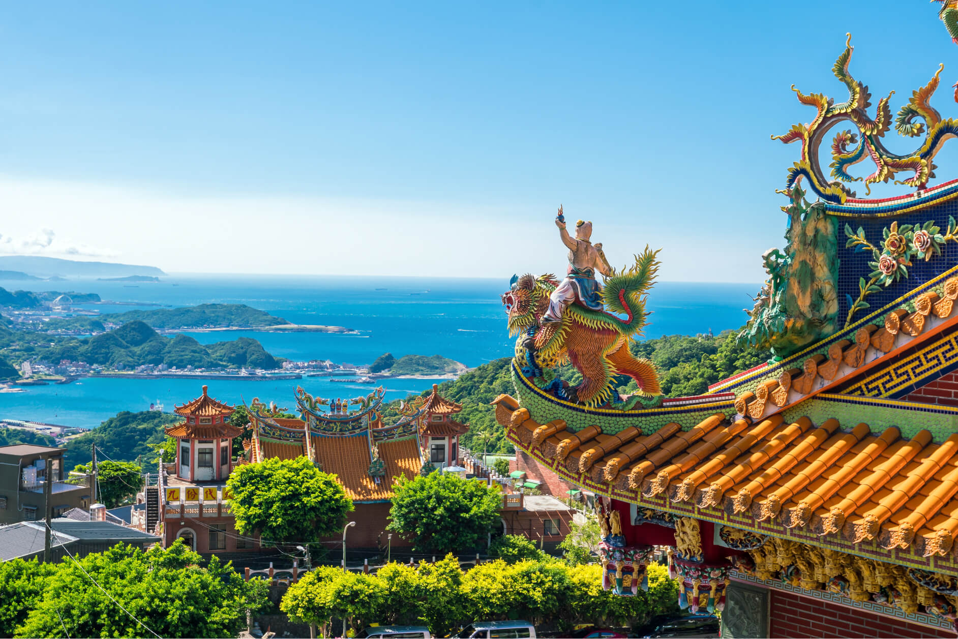 The coastline outside Taipei beneath ornate temple roofs